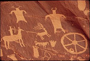NEWSPAPER ROCK IS A LARGE CLIFF MURAL OF ANCIENT INDIAN PETROGLYPHS AND PICTOGRAPHS, REMARKABLE FOR THE CLARITY OF... - NARA - 545671.jpg